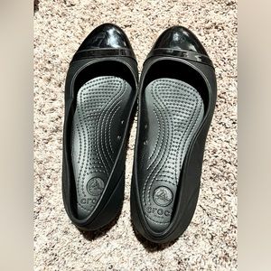 Crocs black cap toe flat slip on shoes, size 7W